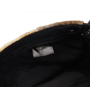Detail of tweed newsboy cap interior showing size label and premium inner lining