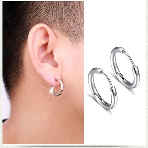 Detail of silver hinge mechanism and earlobe fit on minimalist hoop earrings