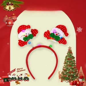 Detail of LED glowing Christmas headband featuring cute snowmen with festive red Santa hats