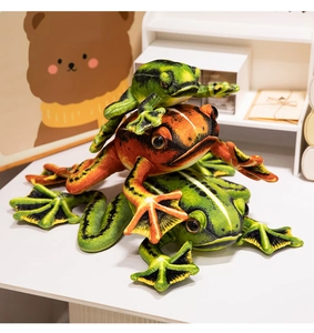 Detailed texture of green and orange plush frog toys in a cute stacked arrangement