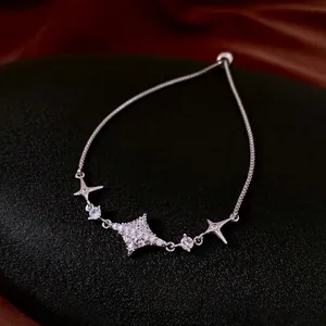 Elegante bracciale con ciondolo a stella in zircone e chiusura regolabile argentata