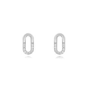 Close-up of silver oval link earrings with sparkling crystal accents and polished finish