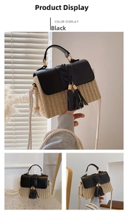 Detail of straw woven saddle bag with black leather flap and stylish long tassels
