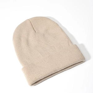Detailed close-up of rib-knit texture and wide folded cuff on a khaki acrylic beanie hat
