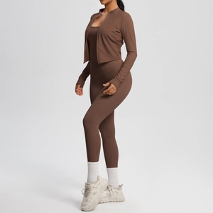 Detail view of brown yoga set with zip-up jacket, racerback top and high waist leggings