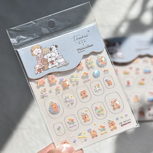 Detail of embossed cartoon dog and bear nail stickers in macaron colors on packaging