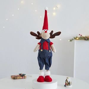 Standing Christmas reindeer plush toy with knit red hat and sweater on festive light base