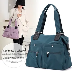 Waterproof nylon tote bag with leather straps and front zip pockets for daily commute