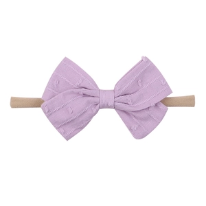 Detail of purple jacquard bow headband for infants with high elasticity nylon band