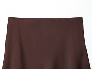 Detail of chocolate brown satin fabric showing smooth texture and elegant drape