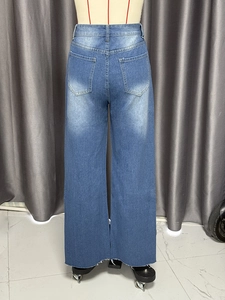 Rear view of high-waist wide-leg blue jeans with back pockets and frayed hem design