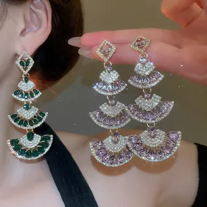 Luxurious tiered fan-shaped drop earrings with green and purple crystals and cubic zirconia