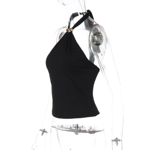 Detailed close-up of a black halter top featuring an elegant gold metal ring at the neckline
