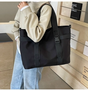 Practical large capacity black canvas tote bag with adjustable shoulder strap for daily use