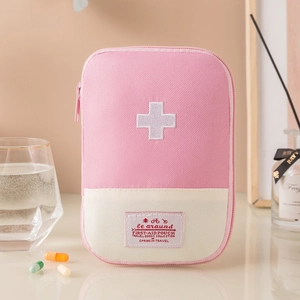 Pink oxford cloth portable first-aid pouch with white cross logo for travel storage