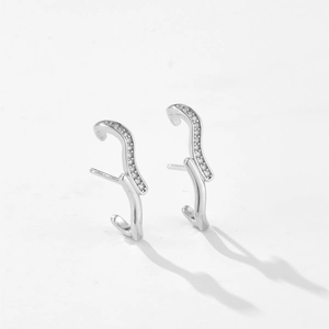 S925 Sterling Silver wave earrings with pavé cubic zirconia studs on white background