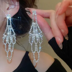 Silver drop earrings with sparkling tassels and hollow geometric design for formal wear