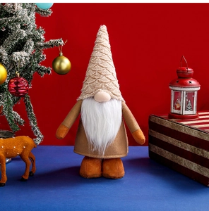 Detail of Nordic Christmas gnome with beige textured hat and plush fabric material