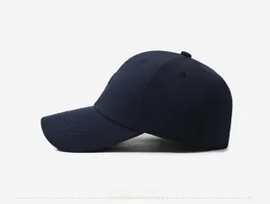 Side view of navy blue baseball cap featuring unique textured embossed lettering on side