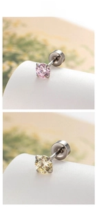 Detail showing 4mm candy-colored cubic zirconia stud earrings with a four-prong silver setting