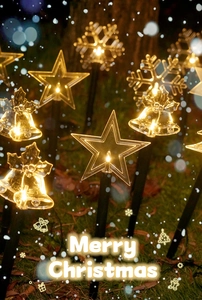 Detail of Christmas solar garden lights with LED star, snowflake and bell shapes