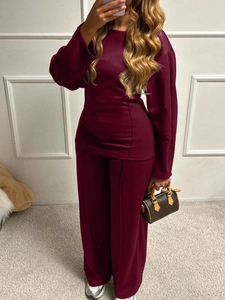 Detailed mirror selfie of women's burgundy two-piece knit set with long sleeve top and pants