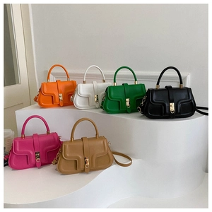 Group display of chic PU leather handbags in six vibrant colors on a white tiered stand