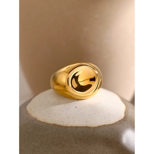 Macro shot of 18k gold plated stainless steel spiral ring with a polished finish