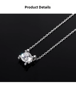 Macro view of geometric zircon pendant with classic four-prong setting on silver chain
