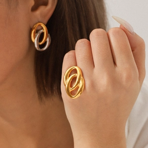 Elegant gold and silver interlocking double hoop earrings and matching ring set for women