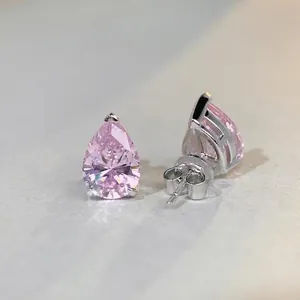 Elegant pear-cut pink stone earrings in minimalist three-prong silver setting