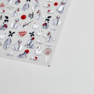 Macro shot of thin nail art stickers featuring Chinese fox scholar and swan designs