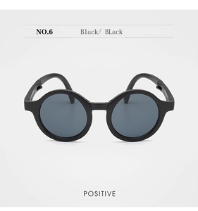 Front view of black round frame foldable kids sunglasses with dark grey lenses NO.6