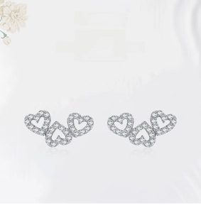 Detail of S925 sterling silver heart stud earrings with sparkling pave micro-zirconia