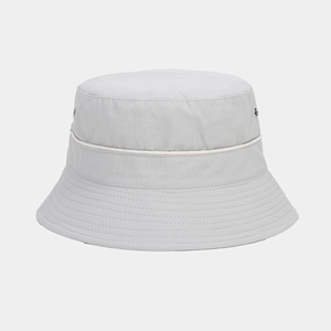 Detail of light gray bucket hat showing metal eyelets and white piping on the crown