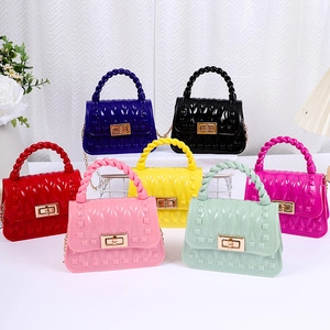 Collection of colorful jelly purses with geometric diamond texture and metallic twist locks