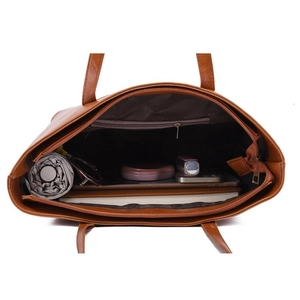 Top view of brown tote bag interior showing spacious capacity and organized storage