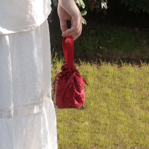 Elegant red lace embroidered wedding candy bag with drawstring and top handle