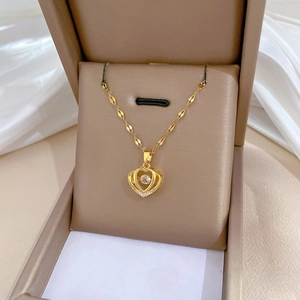 Double-layered golden heart pendant necklace in titanium steel with sparkling zircon stone