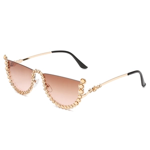 Cat eye semi-rimless sunglasses with gold frame, brown gradient lenses and rhinestone accents