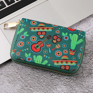 Detail shot of green zipper wallet featuring Mexican Day of the Dead skull patterns
