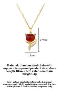 Detail view of fox pendant necklace with red agate and dimensions 2.9cm by 1.5cm