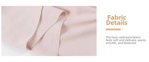 Close-up of soft cashmere-like knit fabric showing delicate texture in pale pink