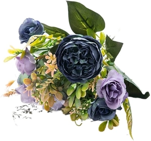 Realistic artificial dark blue and purple peony bouquet with green leaves on white background