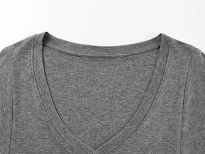 Close-up of deep grey V-neck wool blend knitted top showing fine mottled fabric texture