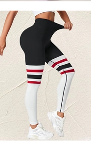 Detail of high-waisted yoga pants featuring color-block stripes and elastic compression fabric