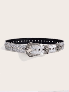 Close-up of vintage western belt featuring sparkling sequins and carved alloy buckle
