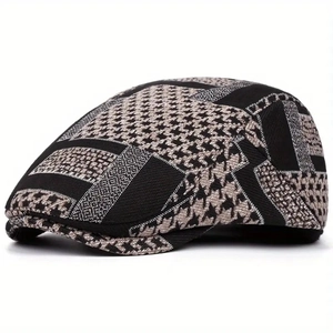 Close-up of houndstooth patchwork and thick wool texture on a stylish newsboy cap