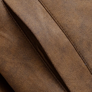 Detailed macro shot of premium dark brown suede fabric with vintage mechanical stitching