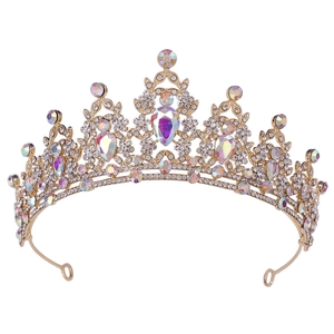 Macro shot of gold wedding tiara with colorful crystal rhinestones and leaf pattern detail